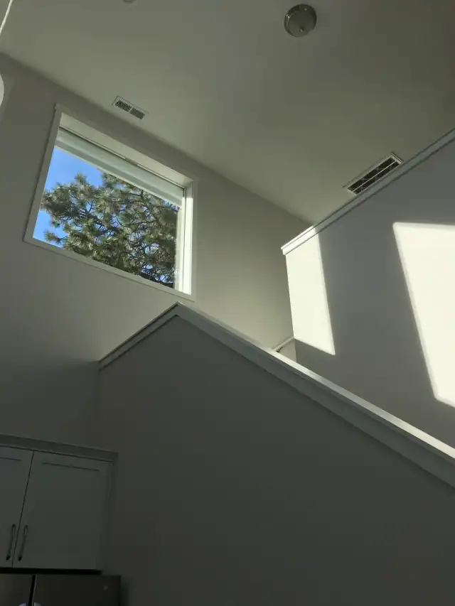 A bright, clean stairwell in a Central Oregon vacation rental